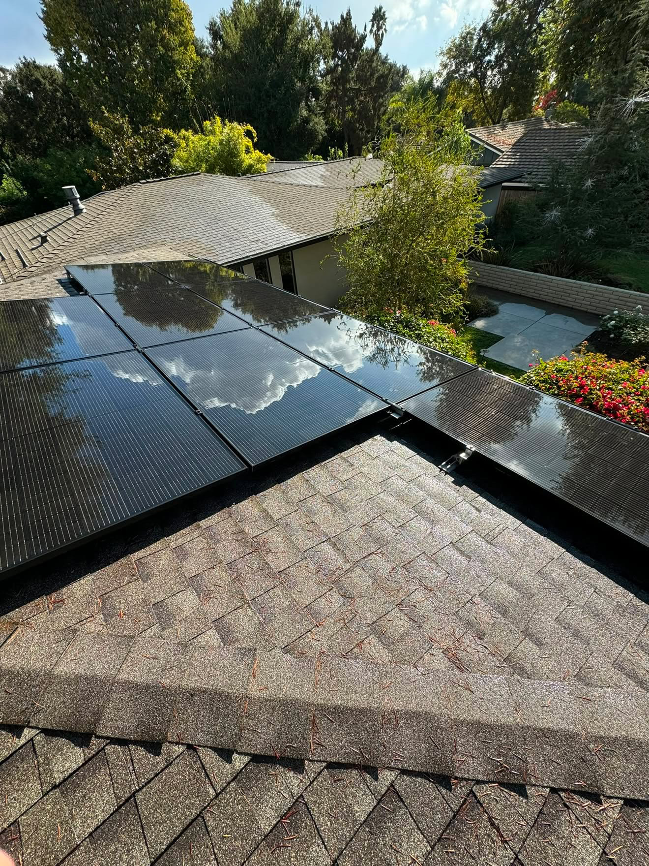 Freshly cleaned solar panels reflecting the sky