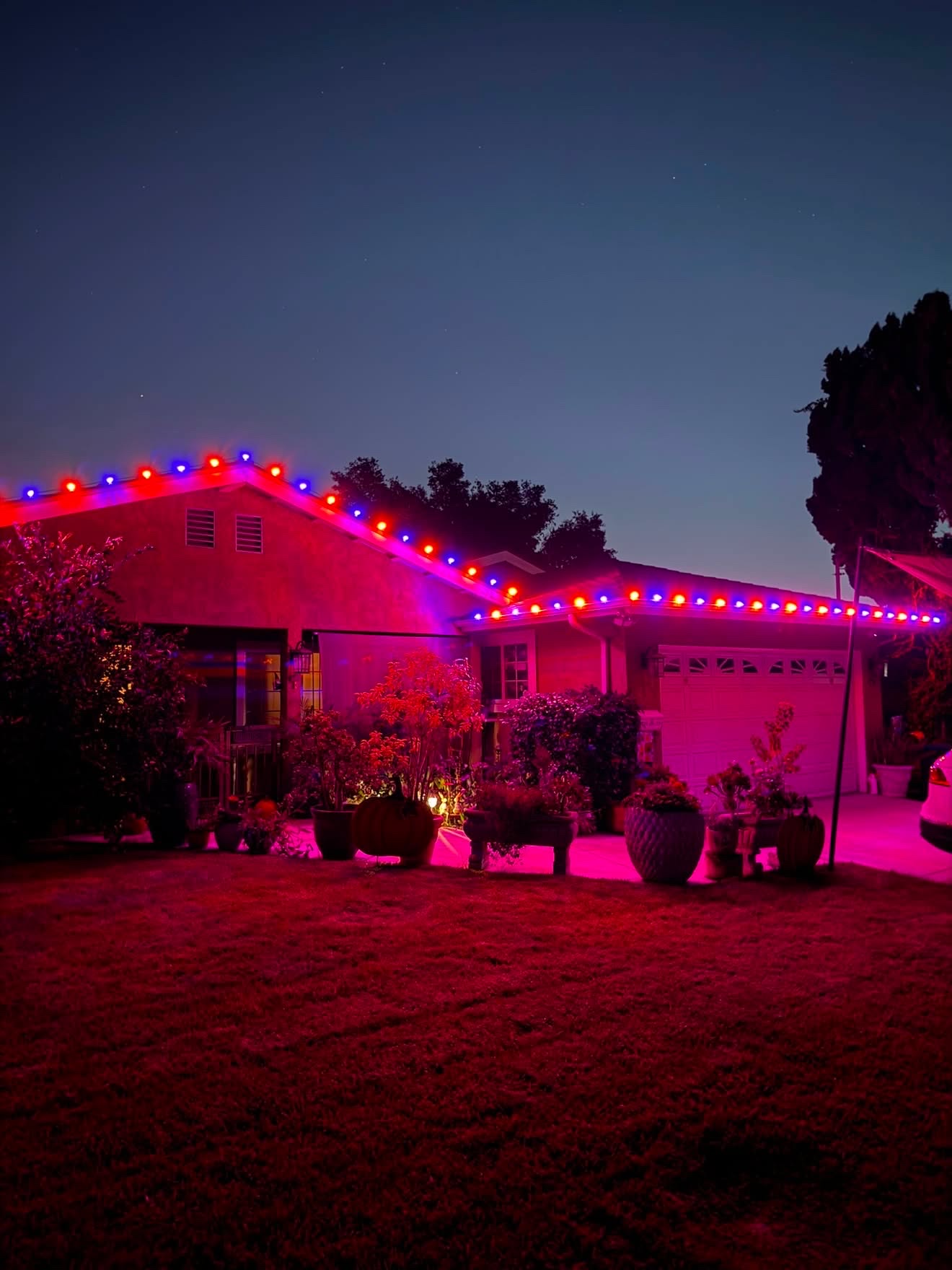Halloween roofline lighting in orange and purple