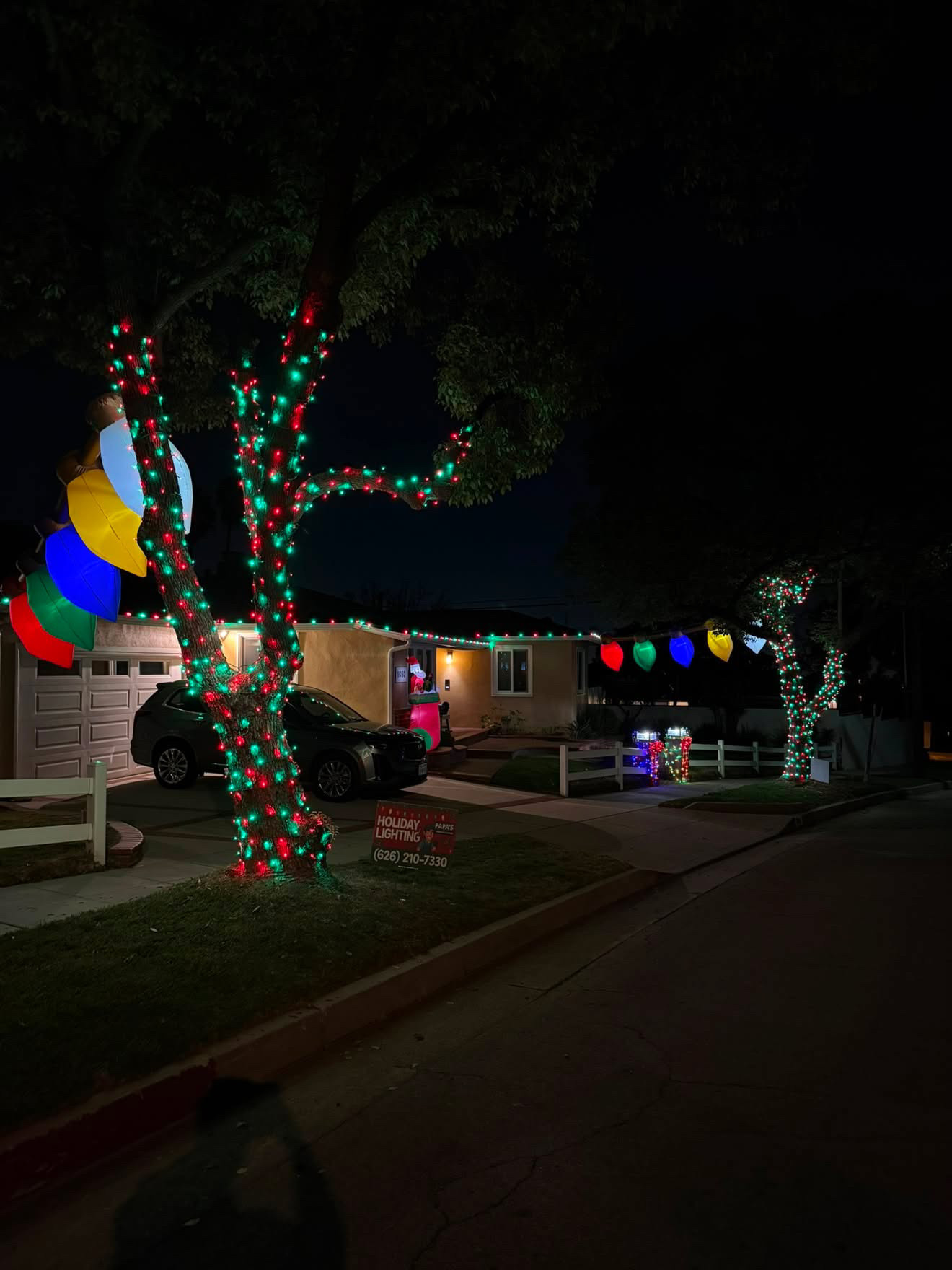 Red and green tree wrap with classic Christmas display