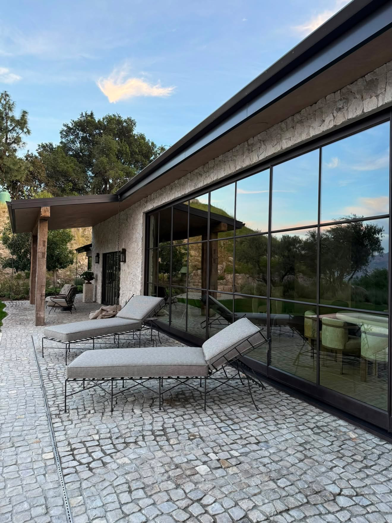 Floor-to-ceiling steel-framed glass wall cleaned to a mirror finish