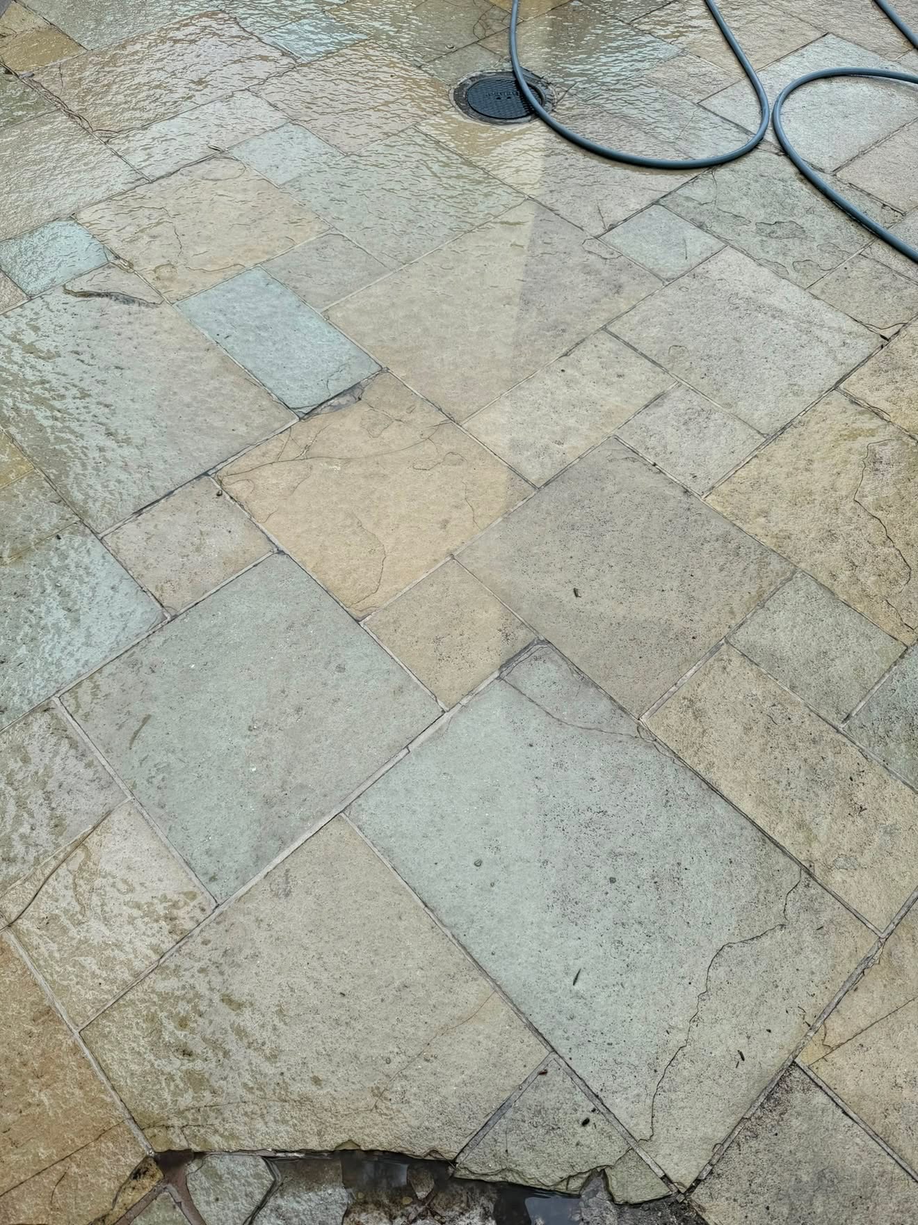 Flagstone patio pressure washed clean